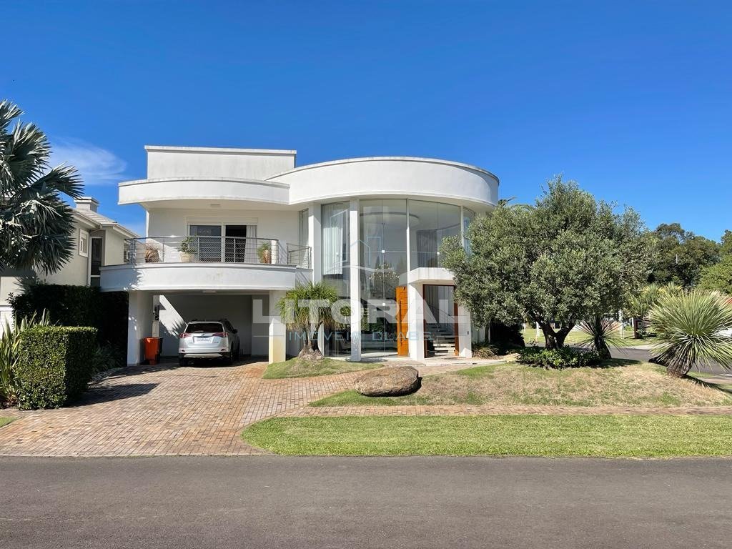 Casa em Condomínio 5 dormitórios no bairro Atlântida Ilhas Park